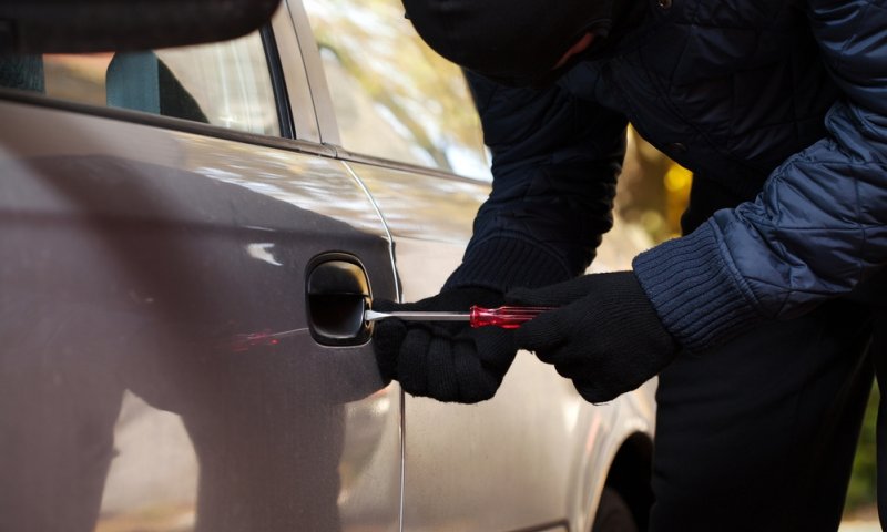 Breaking into a car. Photo archive