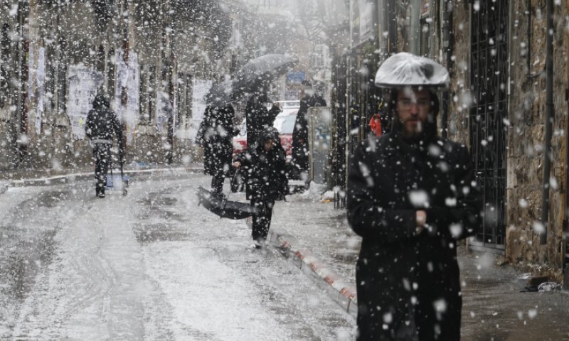 Hasidim in the snow. Photo: Flash 90