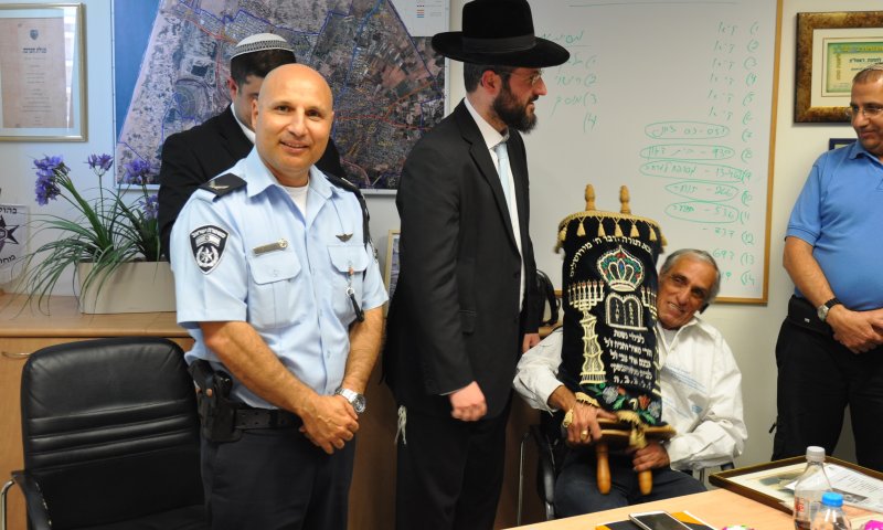 Event of returning the Sefer Torah at the police station. Photo: Police Department spokesperson