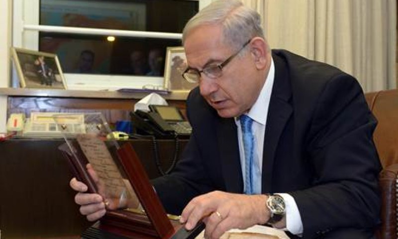 Netanyahu observing the Siddur. Photo by GPO